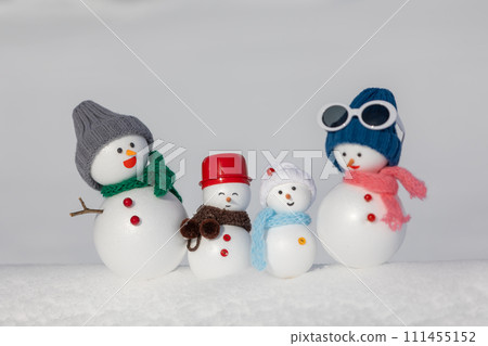 White snow field and snowman family White snow field and snowman family 111455152