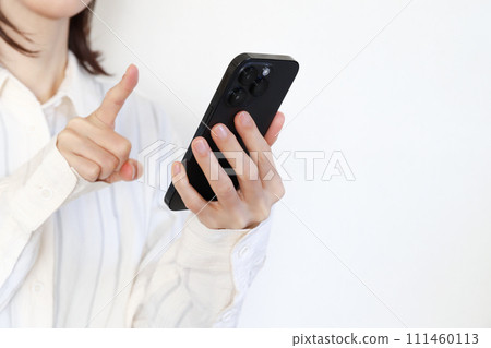 A woman using a smartphone 111460113