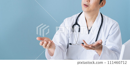 Male doctor examining the electronic medical record 111460712