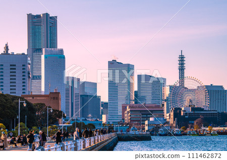 Yokohama, Japan cityscape Bustling Yamashita Park. In the back is towards Sakuragicho. Joint Government Building and Minato Mirai buildings lined up = February 8th 111462872