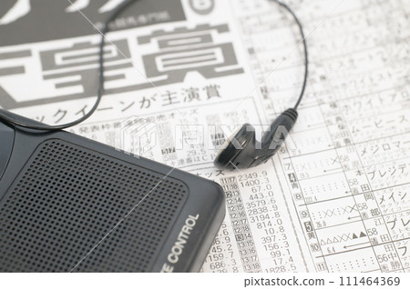 Horse racing newspaper and shortwave radio 111464369