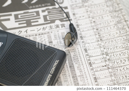 Horse racing newspaper and shortwave radio 111464370