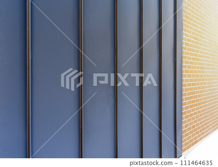 Metal facade trim with dark aluminum panels. Modern house facade and roof Metal facade trim with dark aluminum panels. Modern house facade and roof 111464635