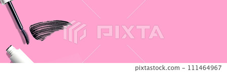 swatch, mascara brushstroke smear, mascara brush composition cosmetic on pink background flat lay banner copy space 111464967