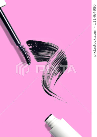 swatch, mascara brushstroke smear, mascara brush composition cosmetic on pink background flat lay vertical 111464980