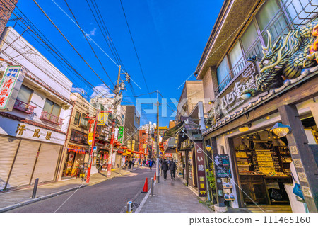 Yokohama cityscape in Japan February. View of Yokohama Chinatown and Kanteibyo Street. "Tenchomon" and Yokohama World in the back = 8th Yokohama cityscape in Japan February. View of Yokohama Chinatown and Kanteibyo Street. "Tenchomon" and Yokohama World in the back = 8th 111465160