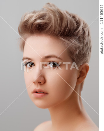 A close up of a woman s face with short hair. face 111465655