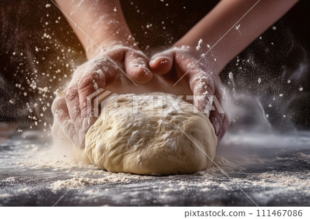Close up view of pair of hands kneading dough in the kitchen Close up view of pair of hands kneading dough in the kitchen 111467086