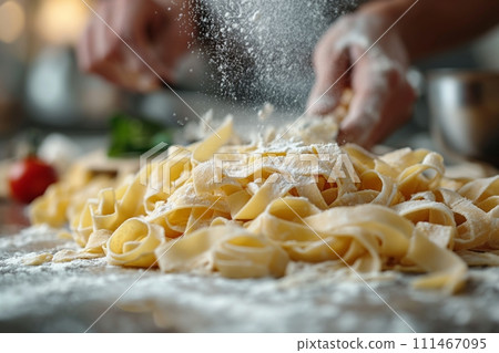 Close up view of hands making fresh italian pasta on wooden kitchen table Close up view of hands making fresh italian pasta on wooden kitchen table 111467095