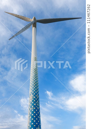 Yokohama City Wind Power Plant, also known as Hama Wing, towers over the blue sky 111467262