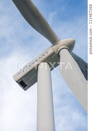 Yokohama City Wind Power Plant, also known as Hama Wing, towers over the blue sky 111467268