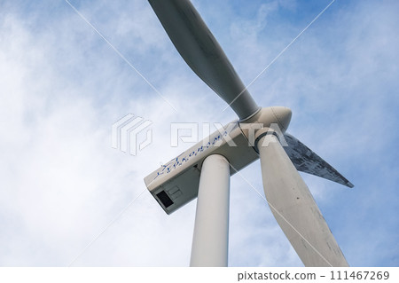 Yokohama City Wind Power Plant, also known as Hama Wing, towers over the blue sky 111467269