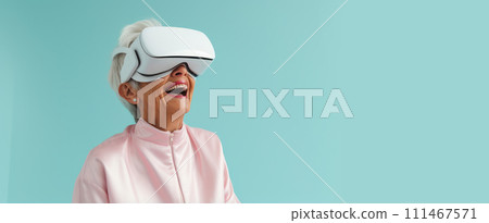 Portrait of a happy smiling enthusiastic Caucasian elderly old, senior woman grey-haired in a virtual reality headset on a blue background. Portrait of a happy smiling enthusiastic Caucasian elderly old, senior woman grey-haired in a virtual reality headset on a blue background. 111467571