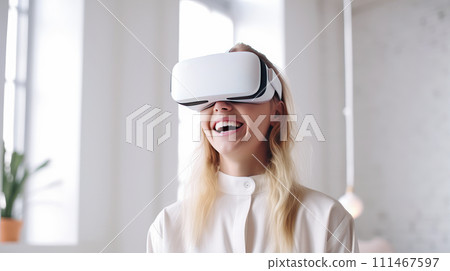 Portrait of a happy smiling passionate Caucasian girl woman blonde man in a virtual reality headset in a white room. Portrait of a happy smiling passionate Caucasian girl woman blonde man in a virtual reality headset in a white room. 111467597