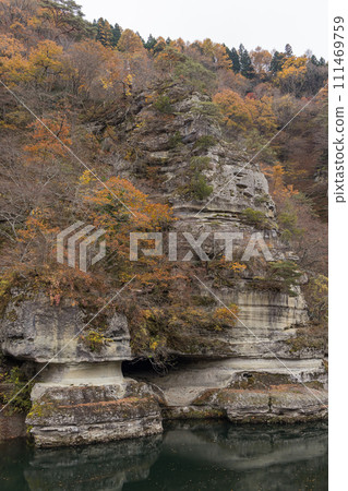 Japan: Valley formed by Agano River flowing through Shimogo Town, Minamiaizu District, Fukushima Prefecture, Tonohetsuri Shrine and autumn leaves 111469759