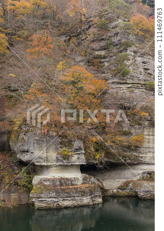 Japan: Valley formed by Agano River flowing through Shimogo Town, Minamiaizu District, Fukushima Prefecture, Tonohetsuri Shrine and autumn leaves 111469763