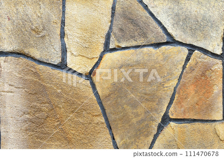 Brown stone wall, background, texture, rectangular natural stones of different shades Brown stone wall, background, texture, rectangular natural stones of different shades 111470678