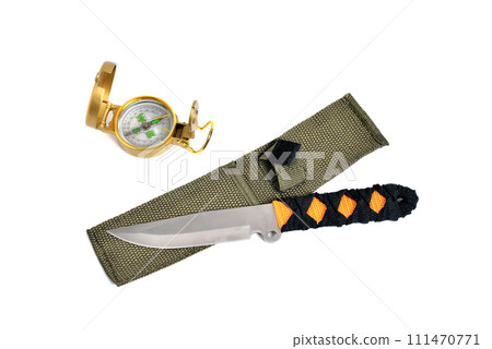 throwing knife and compass, white background close-up throwing knife and compass, white background close-up 111470771