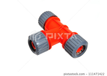 Triple adapter for watering hoses, white background close-up 111471422