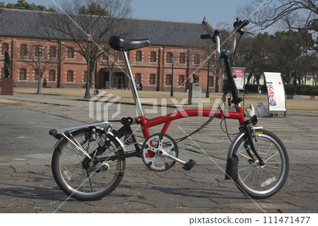 Red bicycle in front of Himeji City Museum of Art 111471477