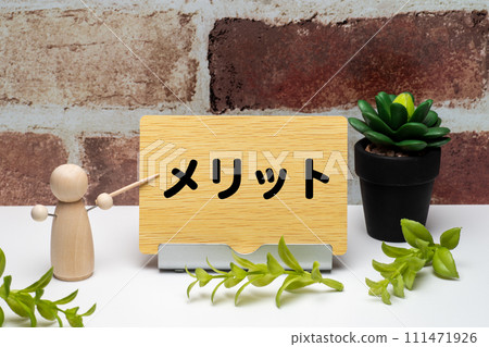 Merit letters and peg dolls on a wooden message board 111471926