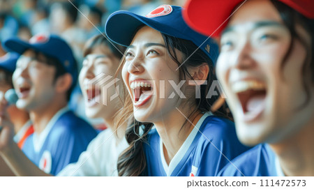 A young woman enthusiastically cheering for sports 111472573