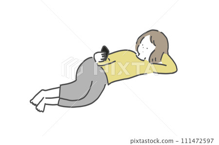 A woman lying down and looking at a smartphone A woman lying down and looking at a smartphone 111472597