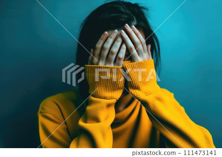 Emotive portrait of young woman with hands covering her face. AI-generated item 111473141