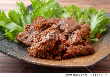 Spicy grilled whale meat 111474364