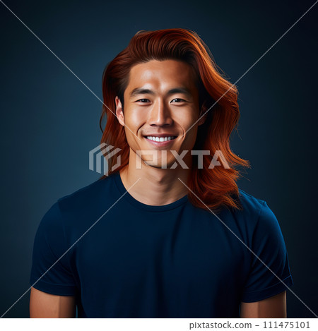 Handsome young man guy smile Asian with long red hair, on a dark blue background, banner, copy space, portrait. 111475101