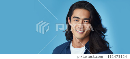 Elegant handsome smiling young Asian man with long hair, on light blue, banner, copy space, portrait. Elegant handsome smiling young Asian man with long hair, on light blue, banner, copy space, portrait. 111475124