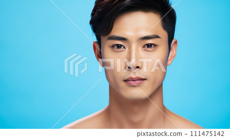 Elegant handsome young male guy Asian, on blue background, banner, copy space, portrait. Elegant handsome young male guy Asian, on blue background, banner, copy space, portrait. 111475142