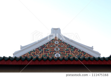 Ancient Chinese style gable of Buddhism church and white sky background. Ancient Chinese style gable of Buddhism church and white sky background. 111475168