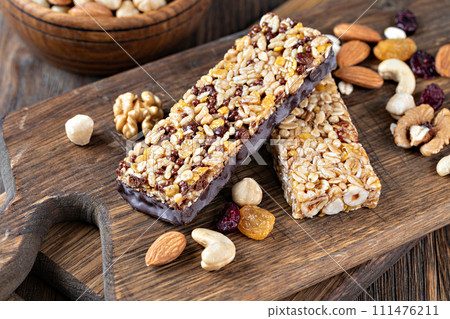 Granola bar on wooden background 111476211