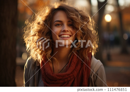 A woman with curly hair smiling 111476851