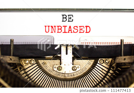 Be unbiased symbol. Concept words Be unbiased typed on white paper on old retro typewriter. Beautiful white background. Business psychology be unbiased concept. Copy space. 111477413