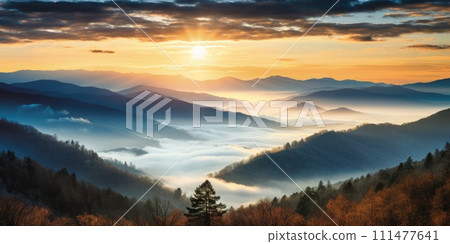 Mountain landscape with forested hills with fog in the valley at sunrise. Breathtaking natural scenery 111477641