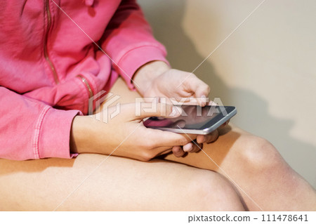Cropped image of woman shitting in the toilet consulting the mobile phone Cropped image of woman shitting in the toilet consulting the mobile phone 111478641
