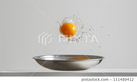Dynamic capture of a cracking egg suspended over a silver bowl. high-speed photography in neutral background. perfect for cooking concepts. AI 111480412