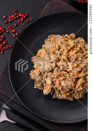 Delicious boiled beef or pork tongue sliced with carrots, onions, sour cream and spices 111480495