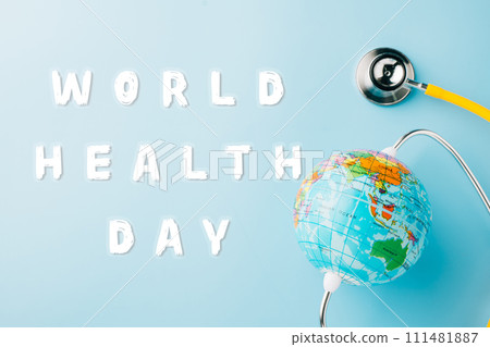 World Health Day Concept. Top view yellow doctor stethoscope and world globe isolated on pastel blue background with copy space, Save world day, Environment Green Earth, Health care and medical 111481887