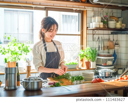Woman cooking in the kitchen Woman cooking in the kitchen 111483627