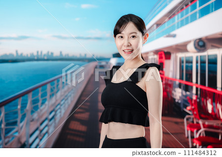 Young woman having fun on a cruise ship Young woman having fun on a cruise ship 111484312