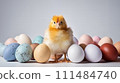 Fluffy Chick with Multicolored Easter Eggs. A cute yellow baby chick stands in front of a lineup of pastel colored Easter eggs 111484740