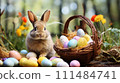 Bunny with Easter Basket in Garden. Cute brown rabbit sits beside a wicker basket filled with colorful pastel Easter eggs in a blooming garden 111484741