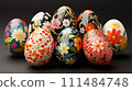 Floral Patterned Easter Eggs on Dark Background. A collection of intricately designed Easter eggs with vibrant floral patterns against a dark backdrop. 111484748