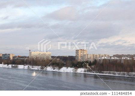 river on a sunny evening. Trees and shrubs. Landscape of winter nature, river banks  111484854
