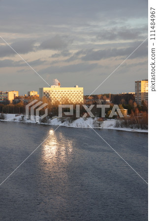 river on a sunny evening. Trees and shrubs. Landscape of winter nature, river banks with bushes. river on a sunny evening. Trees and shrubs. Landscape of winter nature, river banks with bushes. 111484967