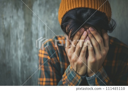 Depressed man covering his face with hands. Dramatic concept. Generative AI 111485110