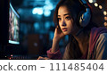 Asian woman looking at computer 111485404